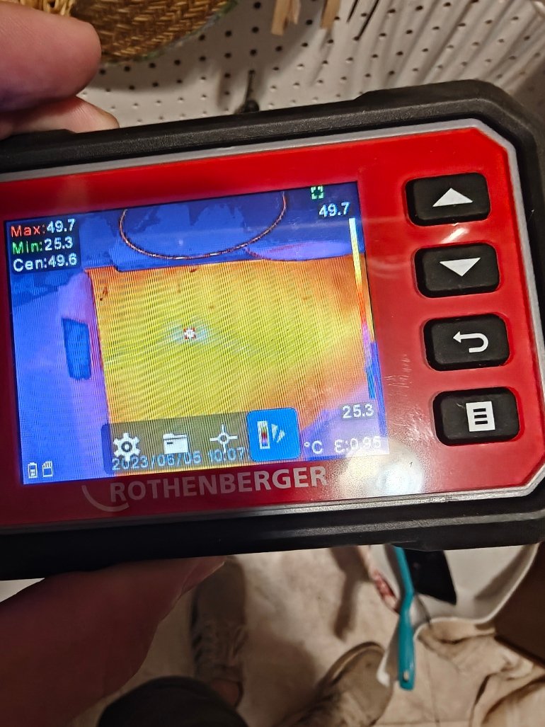 Thermal imaging camera reading used to locate a hidden leak